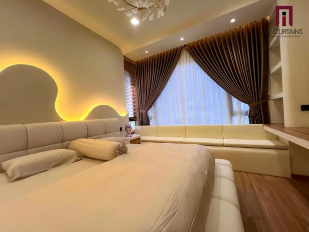 The same bedroom from the foot of the bed, with the drape line following the curve of the ceiling.